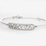 14K White Gold Cuff Bangle Bracelet with Tapered Baguette Cut and Round Cut Diamonds