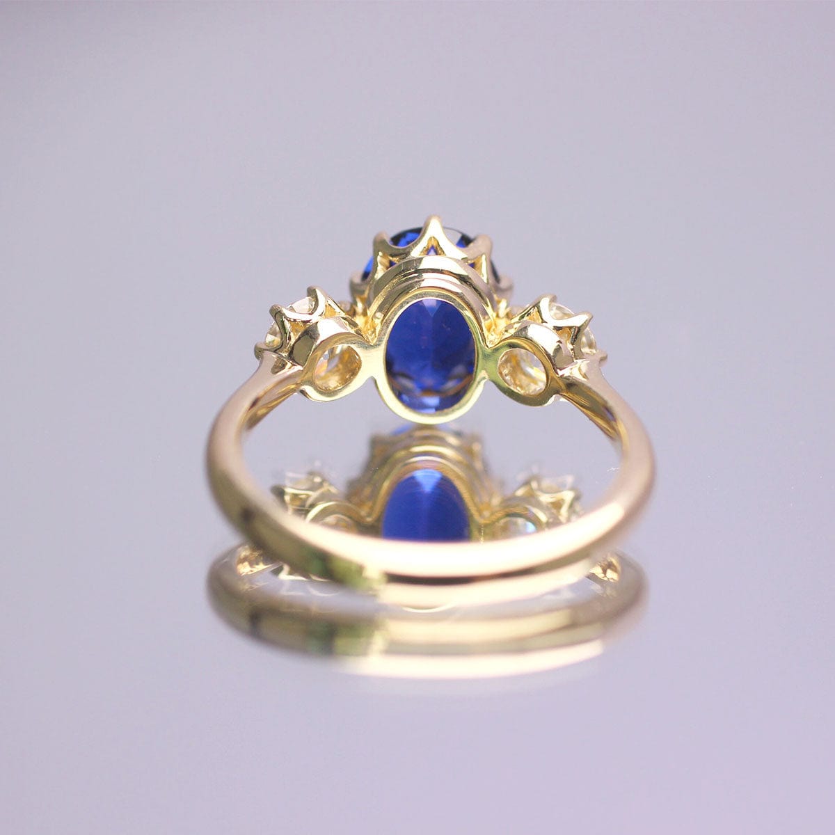 10k Yellow Gold Three Stone Ring Main Stone Blue Sapphire & Moissanite Side Stones