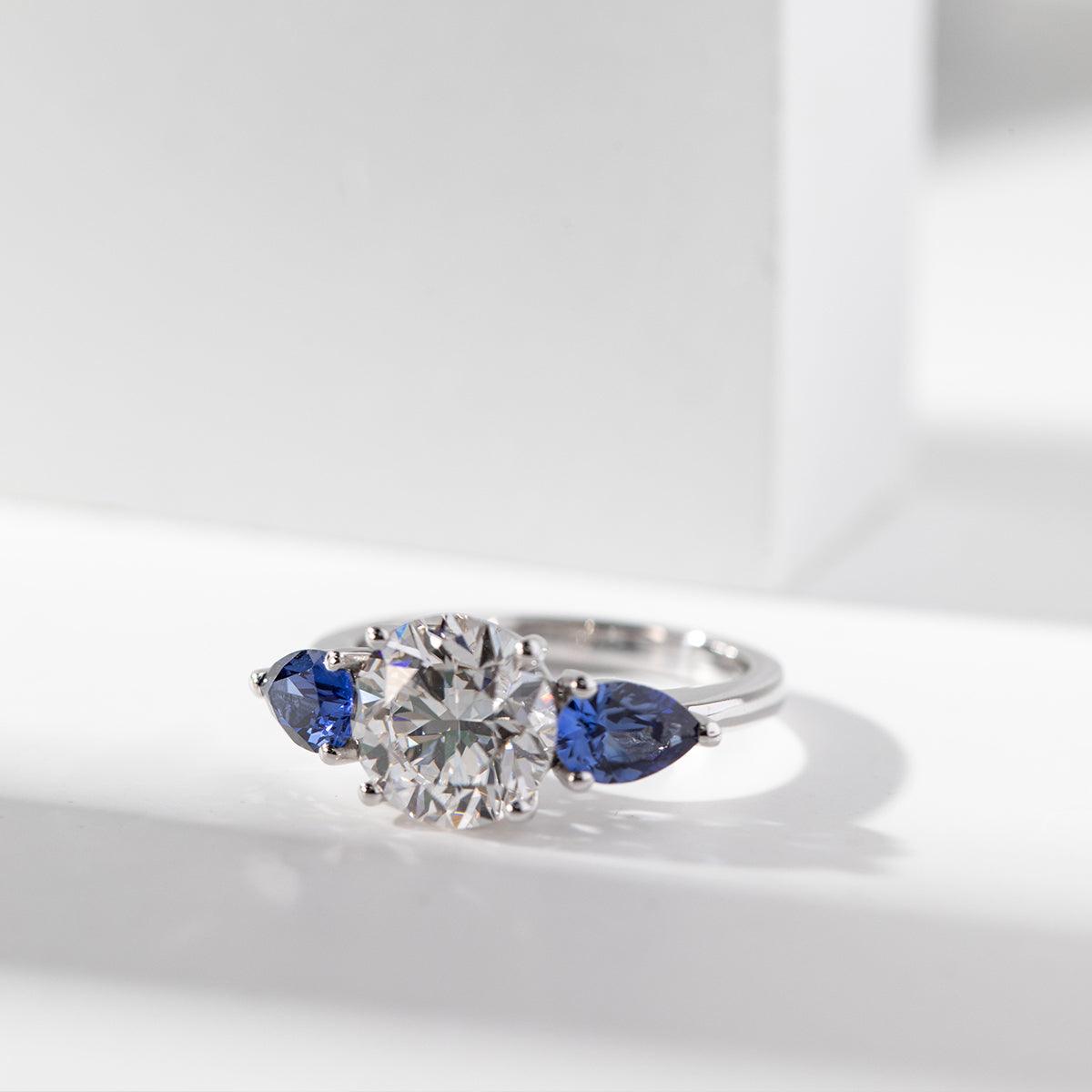 18K White Gold Round Lab Diamond Pear Sapphire Three Stone Ring