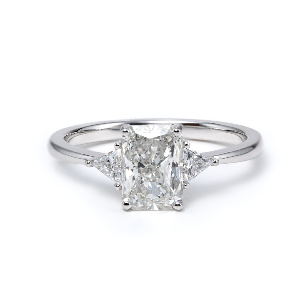 14K White Gold 1.5ct Radiant Cut Lab Diamond Three Stone Ring with Triangular Cut Lab Diamond Side Stones and Tapered Band Design