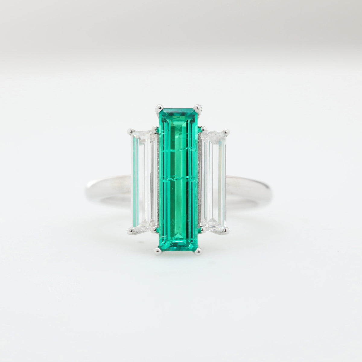 14K White Gold Baguette Cut Emerald Three Stone Ring with Lab Diamond Side-stones