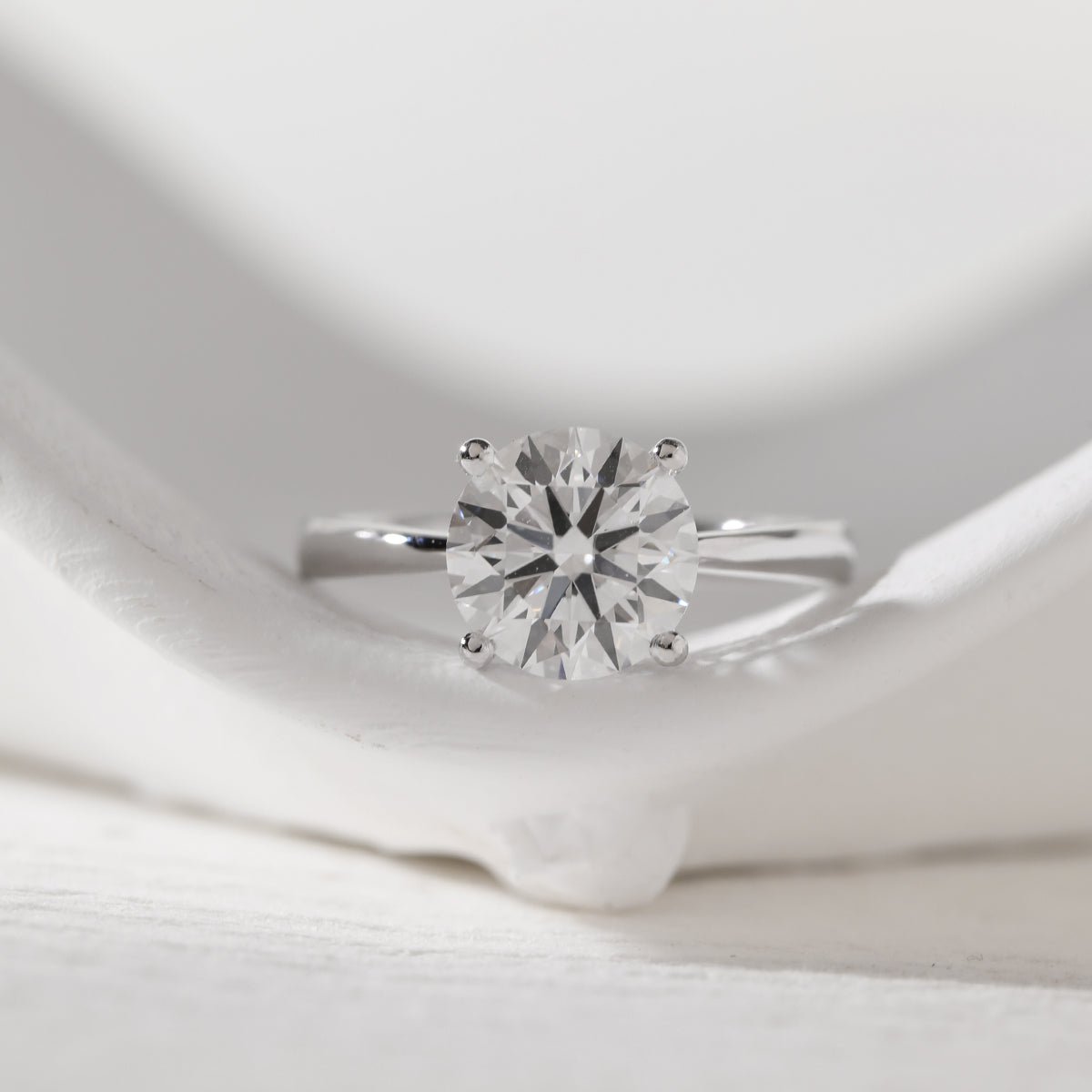 Platinum 3ct Round Lab Diamond 4 Round Prong Basket Solitaire Ring with Tapered Band Design - MMR